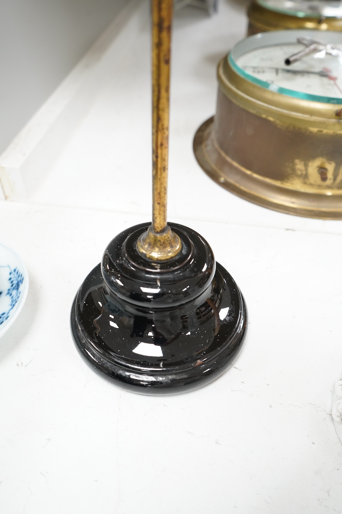 An adjustable wig stand, an oval copper box and a leather black jack jug, 24cm high.